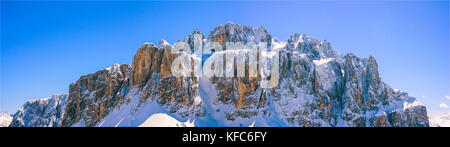 winter mountain panorama with snowcapped peak, Italian Dolomites around Sella Ronda region Stock Photo