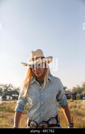 USA, Nevada, Wells, Founder Madeleine Pickens walks around the her 900 square mile property in NE Nevada where Mustang Monument, A sustainable luxury  Stock Photo