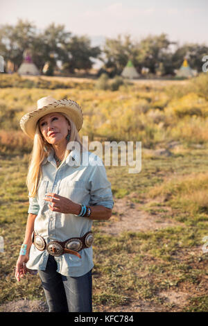 USA, Nevada, Wells, Founder Madeleine Pickens walks around the her 900 square mile property in NE Nevada where Mustang Monument, A sustainable luxury  Stock Photo