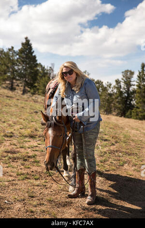 USA, Nevada, Wells, guests can participate in Horse-Back Riding Excursions during their stay at Mustang Monument, A sustainable luxury eco friendly re Stock Photo