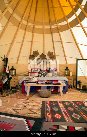 USA, Nevada, Wells, inside of the Luxury Tipis offered at Mustang Monument, A sustainable luxury eco friendly resort and preserve for wild horses, Sav Stock Photo