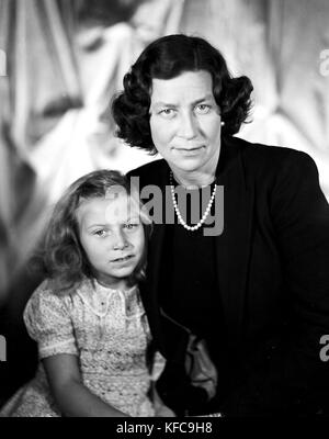 Princess Eugenie of Greece (1910-1989), wife of Prince Dominik Radziwill and daughter of Prince George of Greece and Princess Marie Bonaparte, with her daughter Tatiana Radziwill.  1955  Taponier Photo Photo12.com - Coll. Taponier Stock Photo