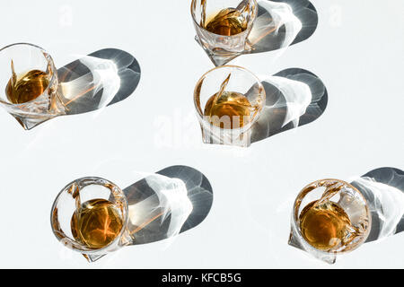 bourbon in glasses with shadows   Stock Photo