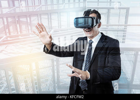 Pleasant confident businessman testing virtual reality Stock Photo