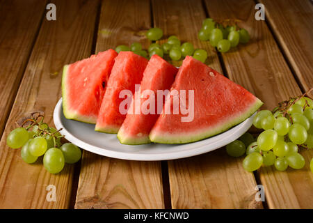 Watermelon slices on white plate - closeup Stock Photo