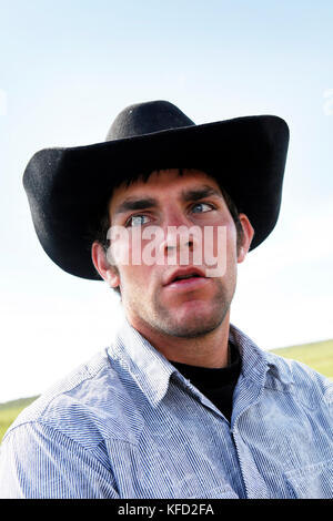 USA, Wyoming, Encampment, portrait of a young male cowboy, Big Creek Ranch Stock Photo