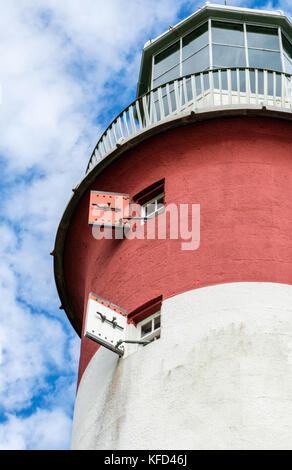 Smeaton's Tower, a red and white striped lighthouse at dusk on Plymouth ...