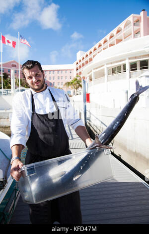 BERMUDA. Hamilton Parish. Marcus' Restaurant kitchen staff with freshly caught fish. Bought from a local fisherman, it will be for the Marcus' Restaur Stock Photo