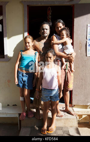 FRENCH POLYNESIA, Tahaa Island. Portrait of tattoo artist Tavita Monea and his family at his home on Tahaa Island. Stock Photo