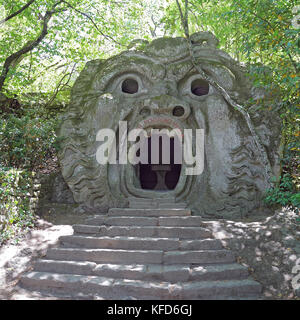 BOMARZO, ITALY - 2 JULY 2017 - Orcus mouth sculpture at famous Parco dei Mostri (Park of the Monsters), also named Sacro Bosco (Sacred Grove) or Garde Stock Photo