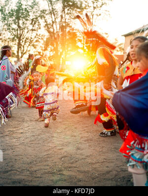 USA, Arizona, Holbrook, group of Navajo Dancers at sunset Stock Photo