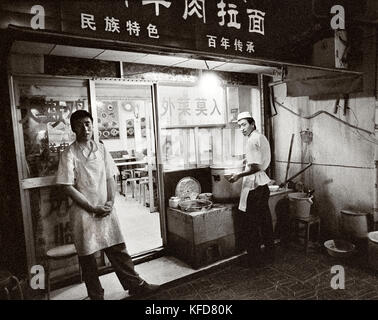 CHINA, Hangzhou, portrait of chefs standing outside a kitchen (B&W) Stock Photo