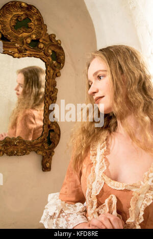 Beautiful woman in Victorian period clothing Stock Photo