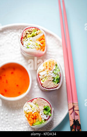 Vietnamese style pork salad bites in mooli ribbons with sweet chilli sauce Stock Photo