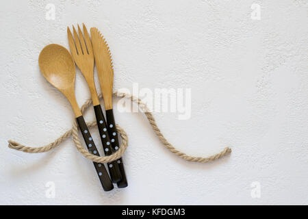 Selection of bamboo cutlery on white background. Stock Photo