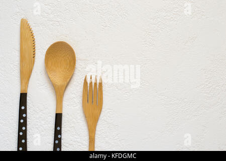 Bamboo fork, knife and spoon on white background closeup, Top view with copy space Stock Photo