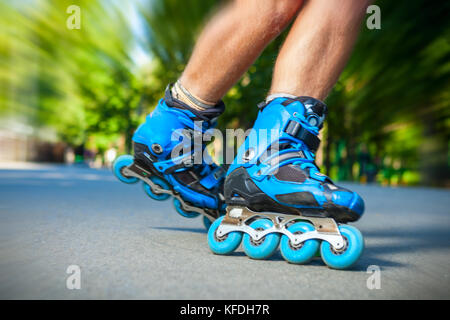 Close up of Inline roller skater on a slalom course. Stock Photo