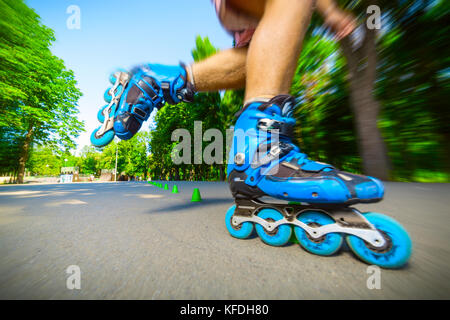 Close up of Inline roller skater on a slalom course. Stock Photo