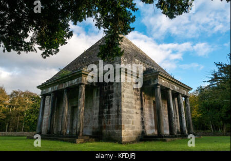 A mausoleum with a pyramid top and Doric porticos in a square grassed walled area, Gosford Estate, East Lothian, Scotland, UK Stock Photo