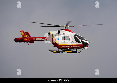 Cornwall Air Ambulance helicopter G-CNWL MD 902 Explorer flying over Cornwall Airport, UK Stock Photo