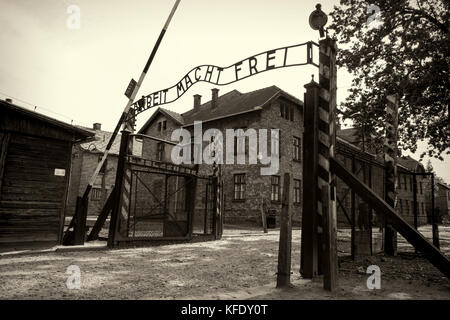 OSWIECIM, POLAND - AUG 18: Arbeit macht frei sign in concentration camp Auschwitz on August 18 2015 in Oswiecim, Poland. Stock Photo