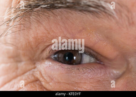 Close up Photo Of Senior Man's Eye Stock Photo