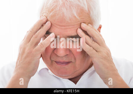 Close-up Of A Senior Man Suffering From Headache Stock Photo