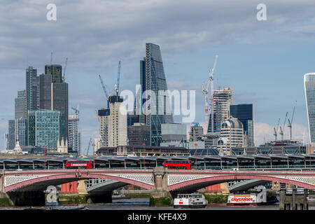 London, UK - August 05, 2017: Blackfriars bridge and skyscrappers and cranes in the City of London on a sunny day Stock Photo