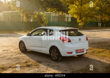 DNIPRO, UKRAINE - SEPTEMBER 05, 2017: KIA CEED WHITE COLOR NEAR THE ROAD IN THE DNIPRO CITY Stock Photo