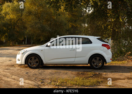 DNIPRO, UKRAINE - SEPTEMBER 05, 2017: KIA CEED WHITE COLOR NEAR THE ROAD IN THE DNIPRO CITY Stock Photo