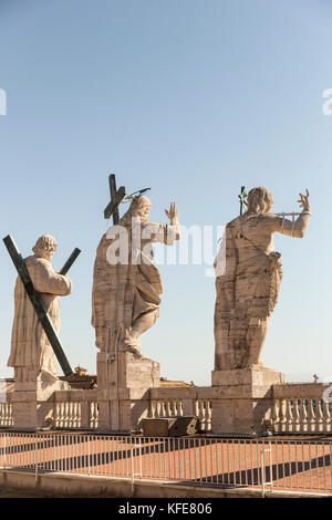 Back view of statues of the saints apostles located on the top of St Peter Basilica roof Stock Photo