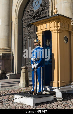 Royal guard on duty outside Royal Palace or Kungliga slottet, Gamla Stan or Old Town, Stockholm, Sweden Stock Photo