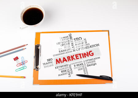 Marketing word cloud, Business concept. Office desk with stationery Stock Photo
