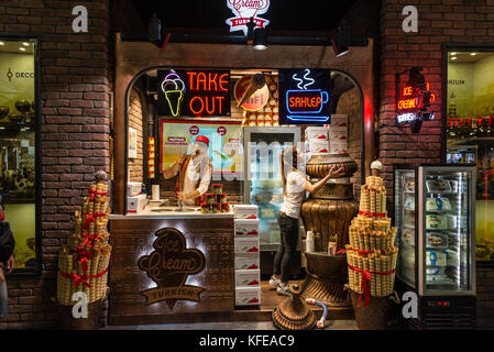 A young man and woman working in a traditional Turkish ice-cream shop. Istanbul, Turkey. Stock Photo
