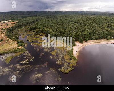 Ontario Canada contryside nature Aerial view looking down from above of a river flowing inside lake Stock Photo