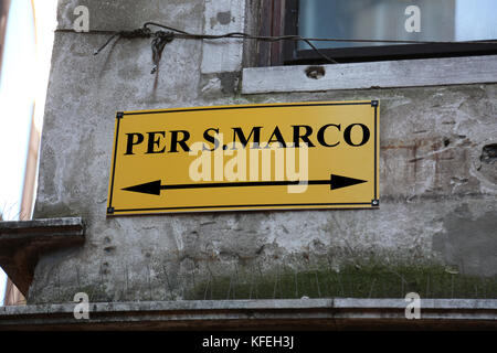 Big signpost with directions to go to St. Mark's Square in Venice in Italy Stock Photo