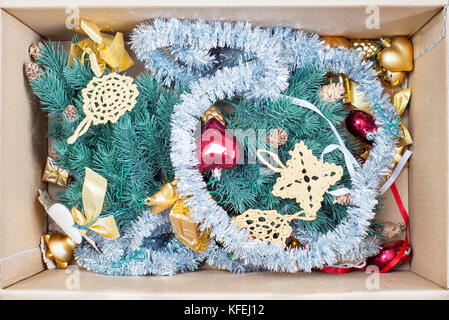 christmas tree, glitter baubles and tinsel in the box Stock Photo