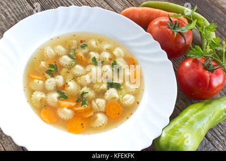 Soup with meatballs and pasta in plate Stock Photo