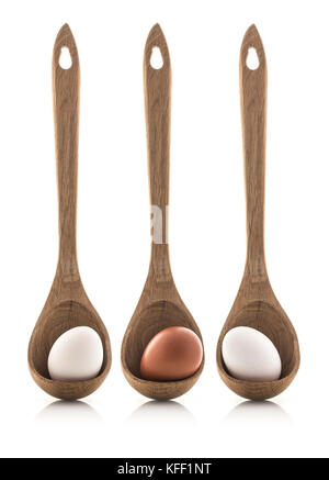 Three Eggs in Wooden Spoons on a white background Stock Photo