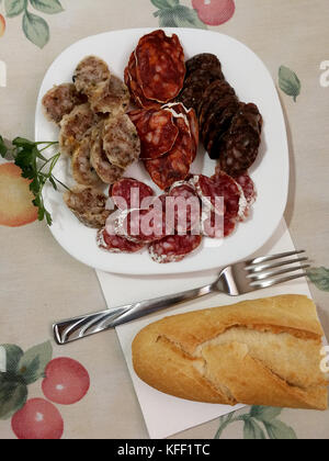 Spanish sausages and appetizer olives Stock Photo