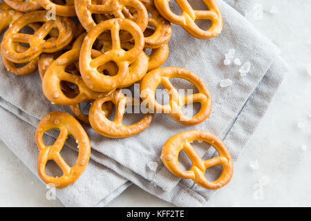 Salty Mini Pretzels with Salt in a Bowl - homemade organic snack for beer Stock Photo