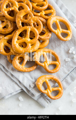 Salty Mini Pretzels with Salt in a Bowl - homemade organic snack for beer Stock Photo