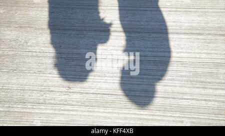 Couple Kissing Shadow. Shadows of Lover Bride and Groom on white wall. Couple Kissing Shadow Stock Photo