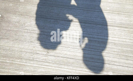 Couple Kissing Shadow. Shadows of Lover Bride and Groom on white wall. Couple Kissing Shadow Stock Photo