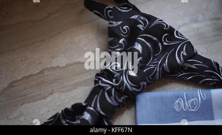 Fragment of a men's shirt with a tie on floor. men's tie and handkerchief. Men's suits dress accessories pocket towel solid color scarf handkerchief Stock Photo
