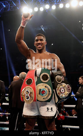 Anthony Joshua celebrates victory over Carlos Takam during the IBF World Heavyweight Title, IBO World Heavyweight Title and WBA Super World Heavyweight Title bout at the Principality Stadium, Cardiff. Stock Photo