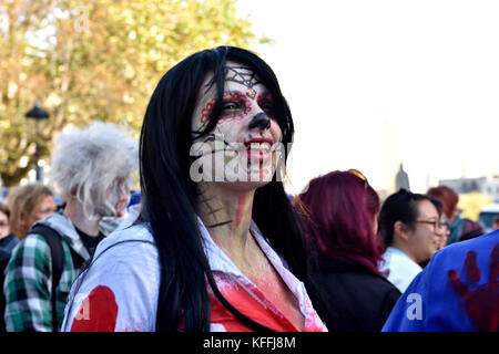 Bristol, UK. 28th Oct, 2017. The undead zombies with representatives walk and shuffle through central Bristol in spectacular costumes starting at College Green, past Castle Park to the Bear Pit in preparation for Halloween. At the end of the walk Avon Fire and Rescue Service’s mass decontamination units are set-up in the Bear Pit using the zombies as practice for mass decontamination.  Fun was had along the way with dancing and partying at the end by the many and varied participants. Credit: Charles Stirling/Alamy Live News Stock Photo