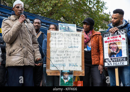 London, UK. 28th October, 2017. The uncle of Jason McPherson addresses campaigners from the United Families and Friends Campaign (UFFC) following the annual procession in remembrance of family members and friends who died in police custody, prison, immigration detention or secure psychiatric hospitals. Jason McPherson, 25, died in hospital after collapsing at a police station where he had been taken to be searched on 18th January 2007. Credit: Mark Kerrison/Alamy Live News Stock Photo