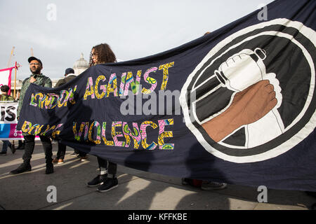 London, UK. 28th October, 2017. Supporters of the United Families and Friends Campaign (UFFC) hold a 'London Against Police Violence' banner before the annual procession in remembrance of family members and friends who died in police custody, prison, immigration detention or secure psychiatric hospitals. UFFC was set up in 1997 by families who had lost loved ones at the hands of the state with the intention of challenging systemic injustice. Credit: Mark Kerrison/Alamy Live News