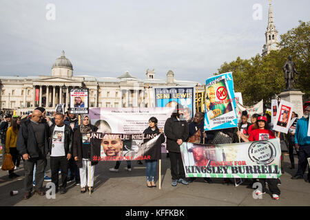 London, UK. 28th October, 2017. Supporters of the Justice for Kingsley Burrell and Justice for Yassar campaigns prepare to take part in the annual United Families and Friends Campaign procession in remembrance of family members and friends who died in police custody, prison, immigration detention or secure psychiatric hospitals. UFFC was set up in 1997 by families who had lost loved ones at the hands of the state with the intention of challenging systemic injustice. Credit: Mark Kerrison/Alamy Live News Stock Photo